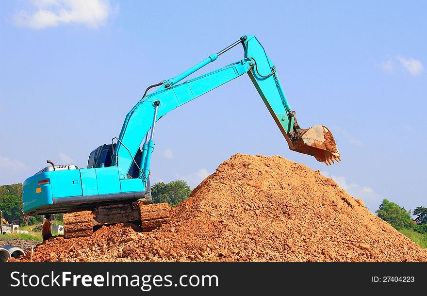 Excavator loader machine during works outdoor at construction site