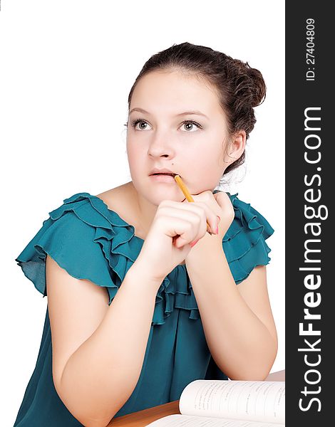 Pretty  schoolgirl thought on isolated white background. Pretty  schoolgirl thought on isolated white background