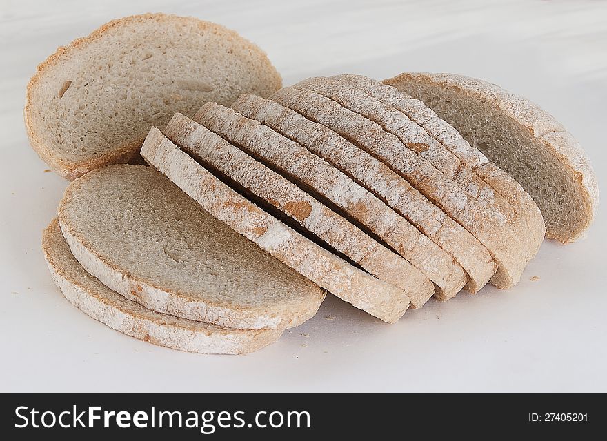 The gray bread cut on pieces on a pink napkin