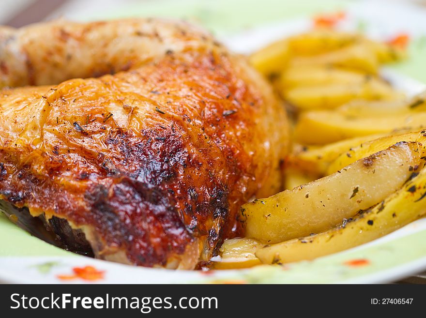 Chicken leg with potatos. Picture proper for menu design.