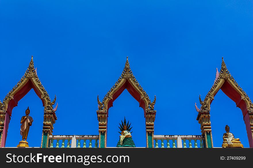Thai art, Buddha images on roof top of building in temple, Phuket, Thailand