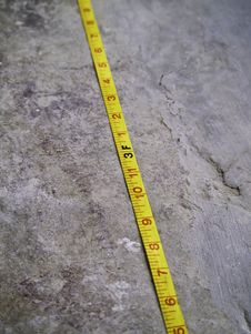 Construction Measuring Tape On Grunge Concrete Stock Photo Construction Measuring Tape On Grunge Concrete Stock Photo