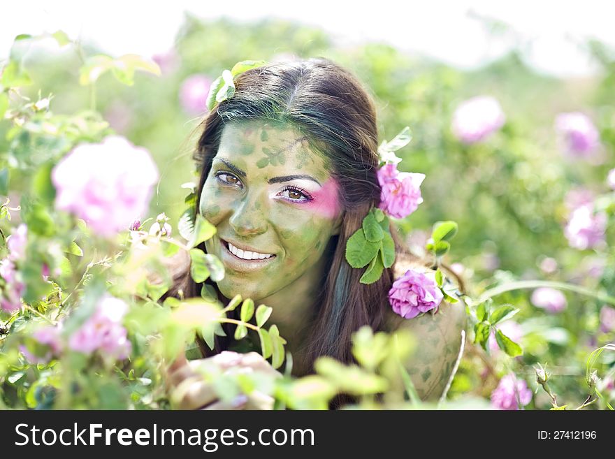 Beautiful girl in a rose field. Beautiful girl in a rose field