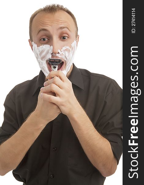 Man with shaver  and foam on face having fun against pure white background. Man with shaver  and foam on face having fun against pure white background