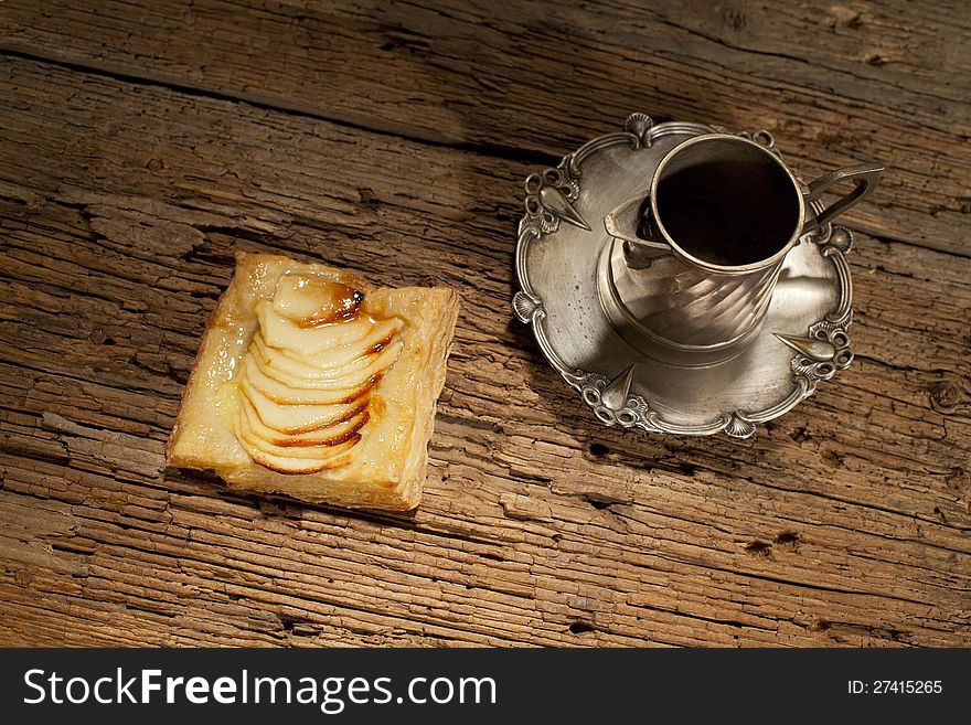 sliced apples on pastry food and silver objects. sliced apples on pastry food and silver objects