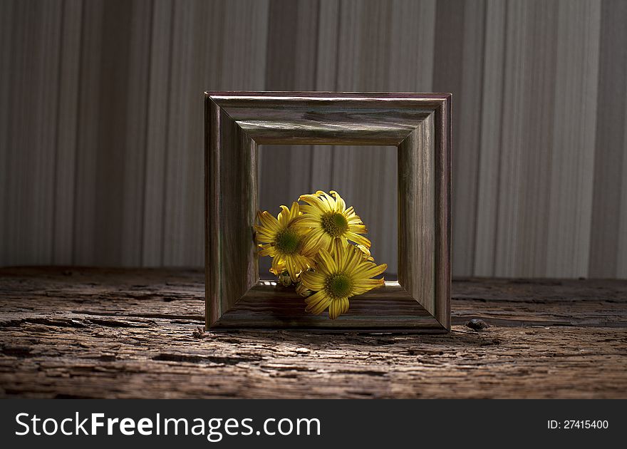 Yellow flowers decorating artistic frame. Yellow flowers decorating artistic frame