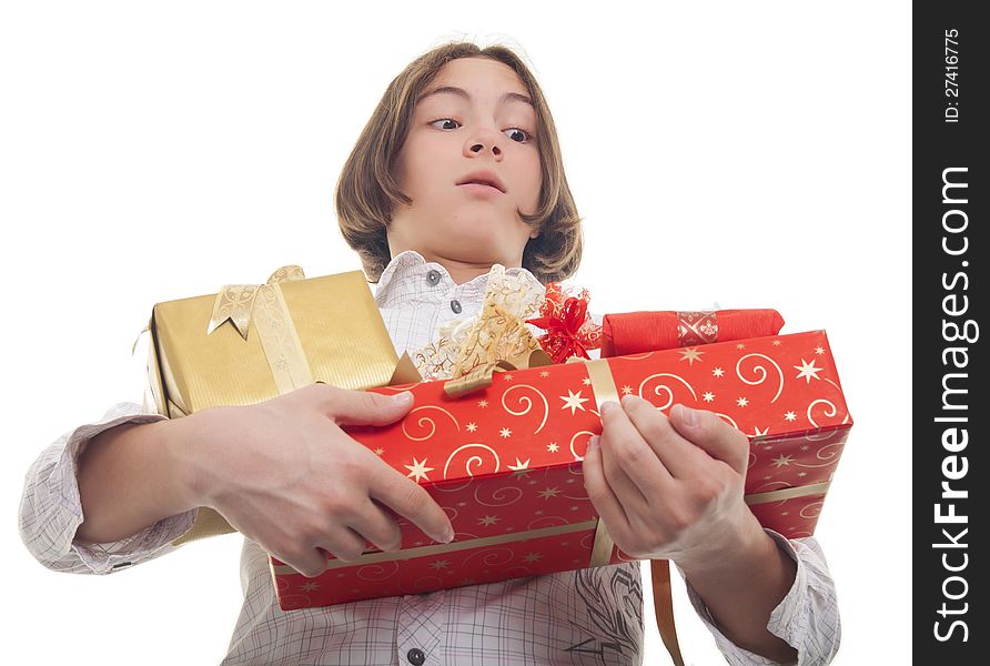 Handsome teenage boy with bunch of presents in his hands. Handsome teenage boy with bunch of presents in his hands