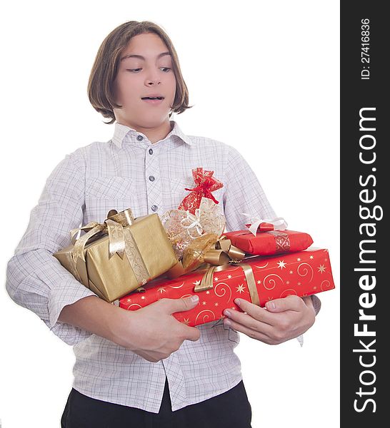 Handsome teenage boy with bunch of presents in his hands. Handsome teenage boy with bunch of presents in his hands