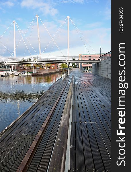 This image presents a beautiful promenade near the water in Holland. This image presents a beautiful promenade near the water in Holland