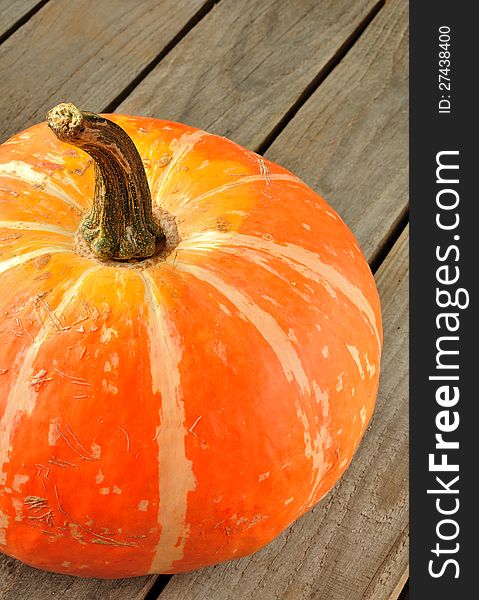 A Pumpkin On A Wooden Surface