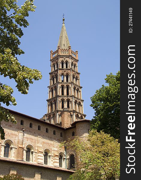 The famous spire of the Romanesque church built in the French city around 1100. The famous spire of the Romanesque church built in the French city around 1100