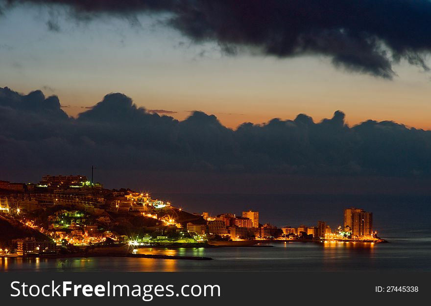 Small spanish city Cullera (Valencia region, Spain) at sunset. Small spanish city Cullera (Valencia region, Spain) at sunset