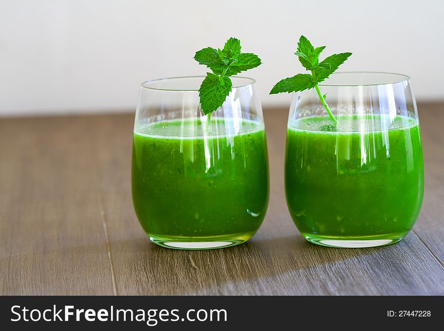 Two glasses of healthy wheat grass juice. Two glasses of healthy wheat grass juice