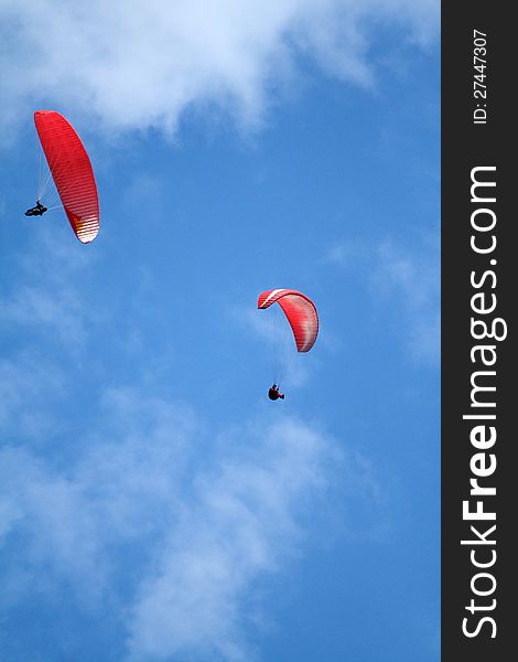 Two para gliders in blue sky. Two para gliders in blue sky