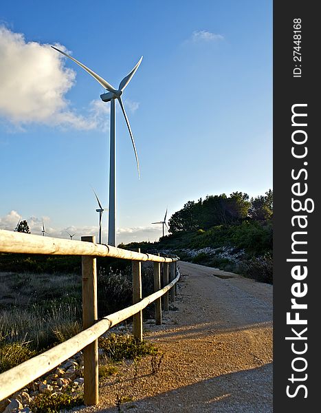 Modern wind energy park park. Eolic generator in the mountain.