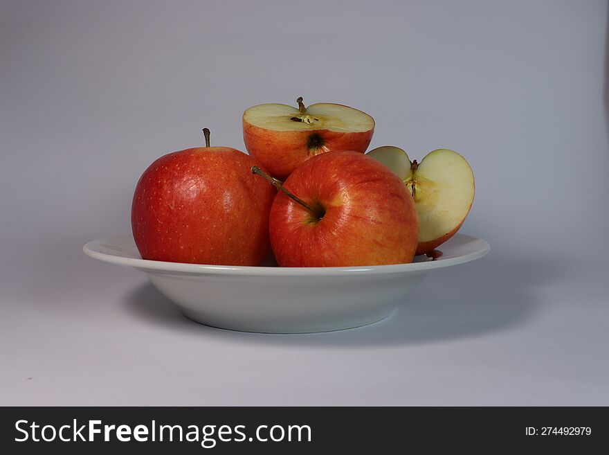 Red Apples On A White Plate, Half An Apple, White Plate, Red Apples