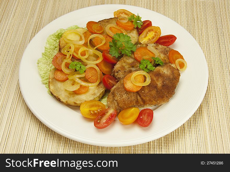 Fried chicken fillets with stewed vegetables