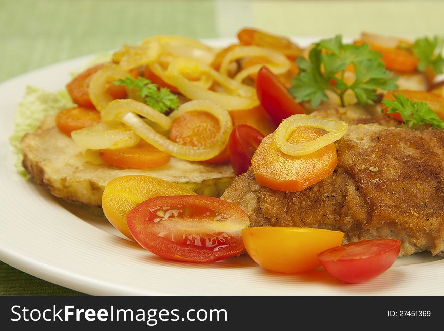 Fried chicken fillets with vegetables