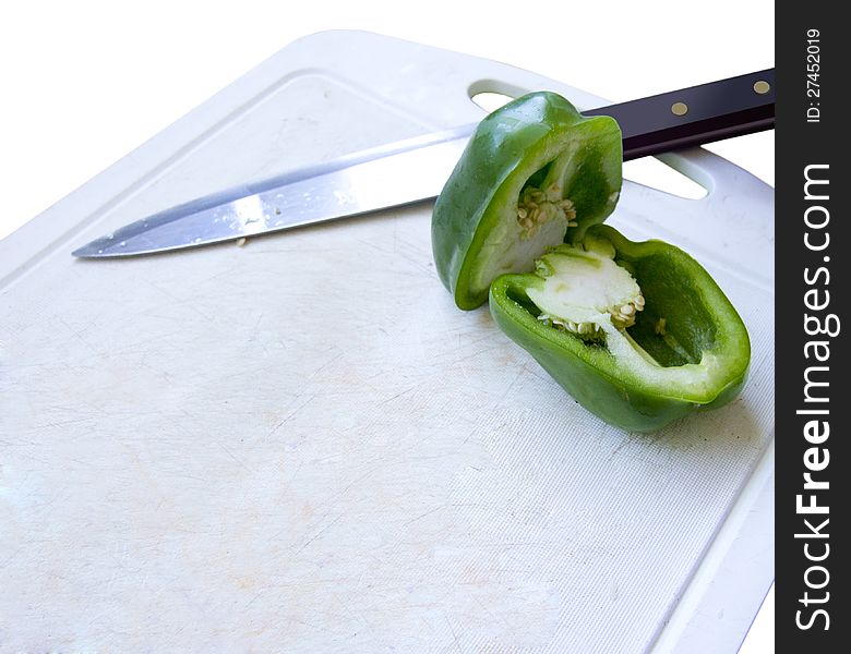 Capsicum and knife on the cutting board
