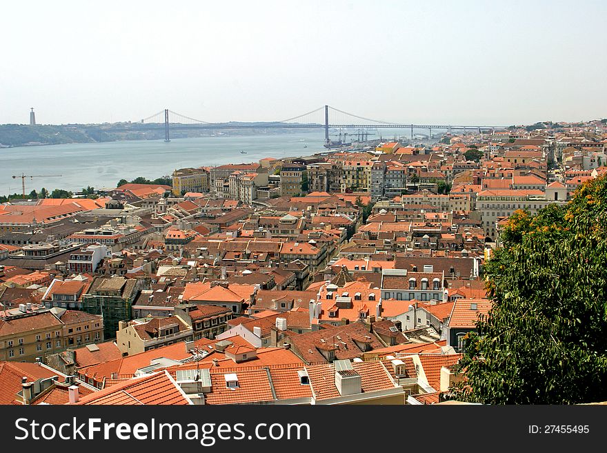 View from Castelo de S. Jorge to 25 April bridge in Lisbon , Portugal .