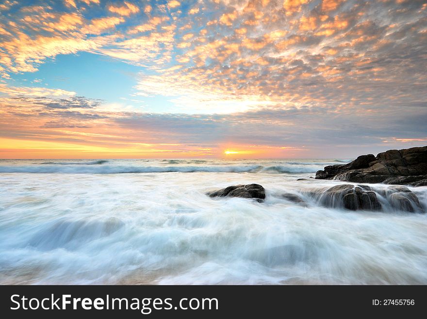 Sea wave on the beach at sunset time. Sea wave on the beach at sunset time