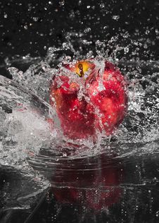 Fresh An Apple In Streaming Water. Royalty Free Stock Photography