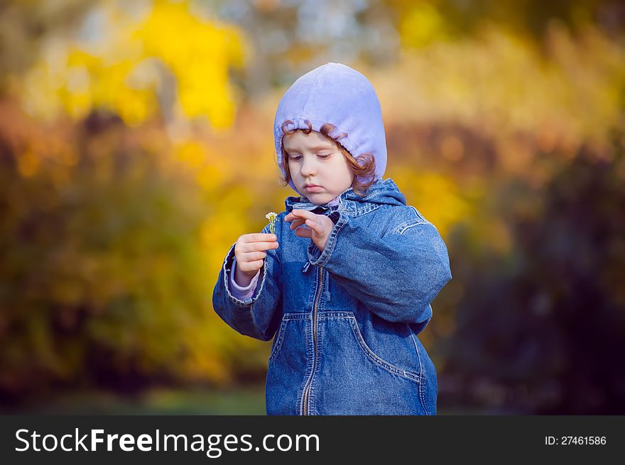 Little Curly Girl In Autumn Park