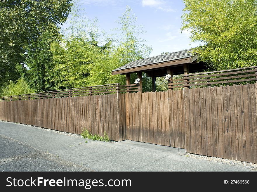 Wooden fence, gate and bamboo