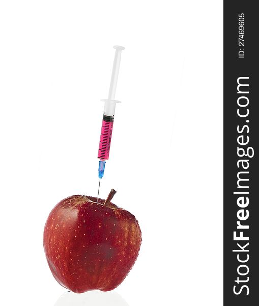 Red Apple And Syringes Isolated On White