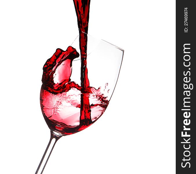 Red Wine Splashing In A Glass, Isolated On White