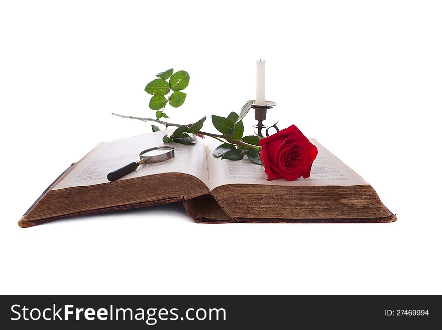 Open Book, Red Rose, Magnifying Glass And Candle