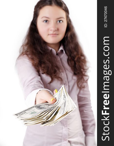 Portrait of a pretty brunette girl giving money isolated