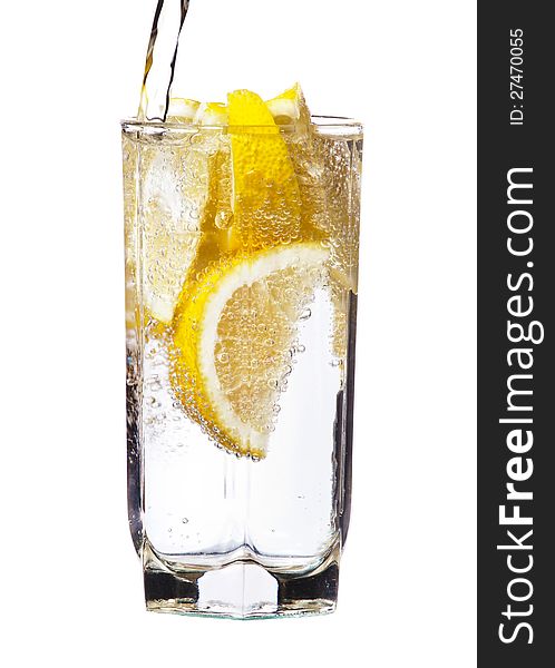 Full glass of water with lemon isolated on white background