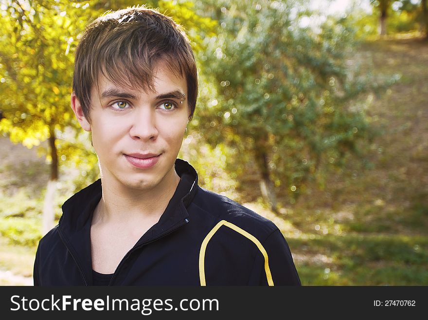 Outdoors portrait of happy young man