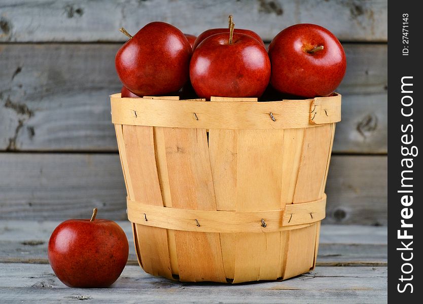 Basket of freshly picked red apples. Basket of freshly picked red apples