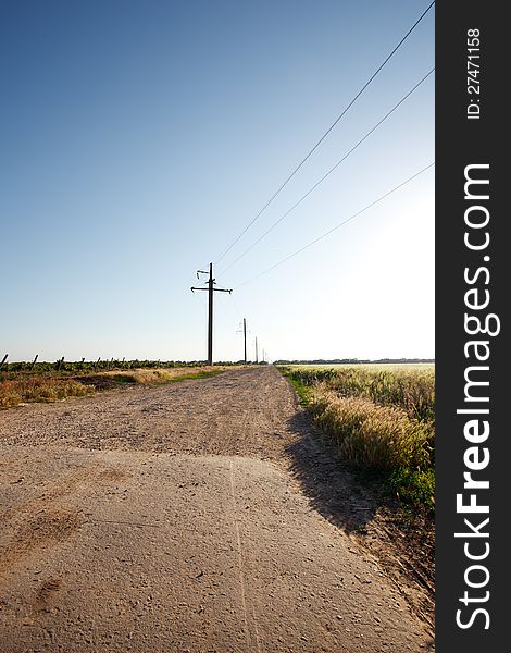 Rural road and the blue sky and grass