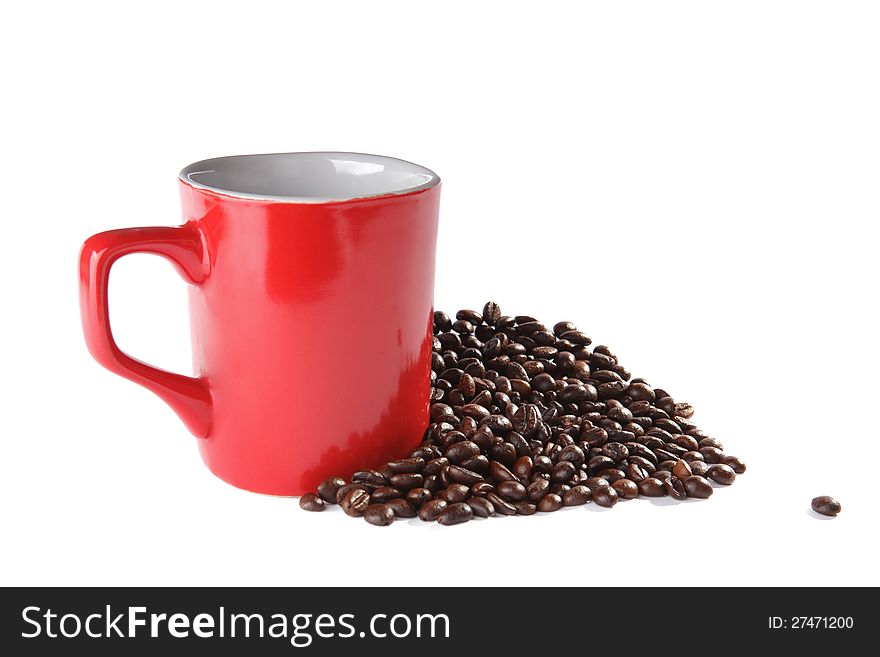 Square red ceramic cup and coffee beans over white background
