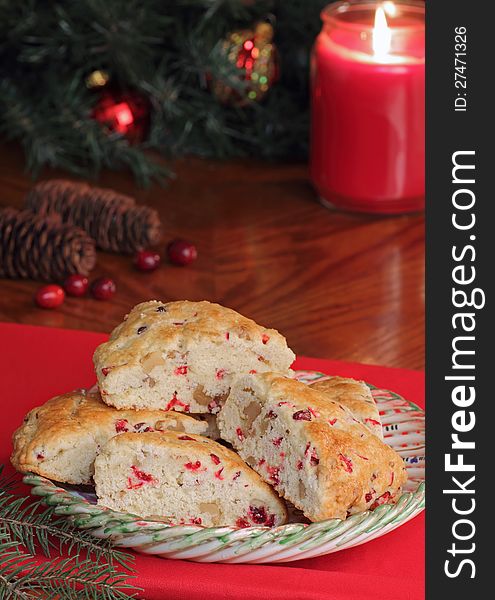 Cranberry nut scones with Christmas decorations in background. Cranberry nut scones with Christmas decorations in background