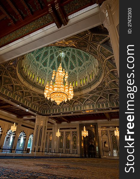 Lavish and beautifully designed inside of the Sultan Qaboos Grand Mosque in Muscat, Oman, also showing the crystal chandeliers. Lavish and beautifully designed inside of the Sultan Qaboos Grand Mosque in Muscat, Oman, also showing the crystal chandeliers.
