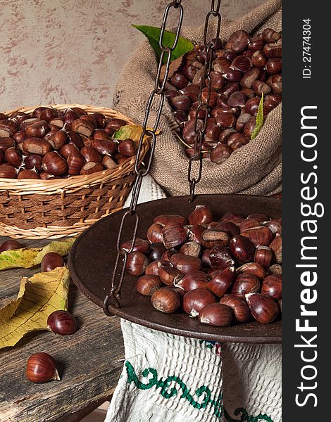 Still life with chestnuts and balance ancient