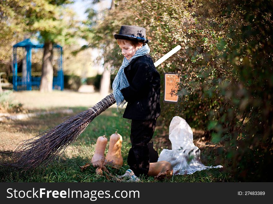 The nature boy in black hat and coat celebrates Halloween