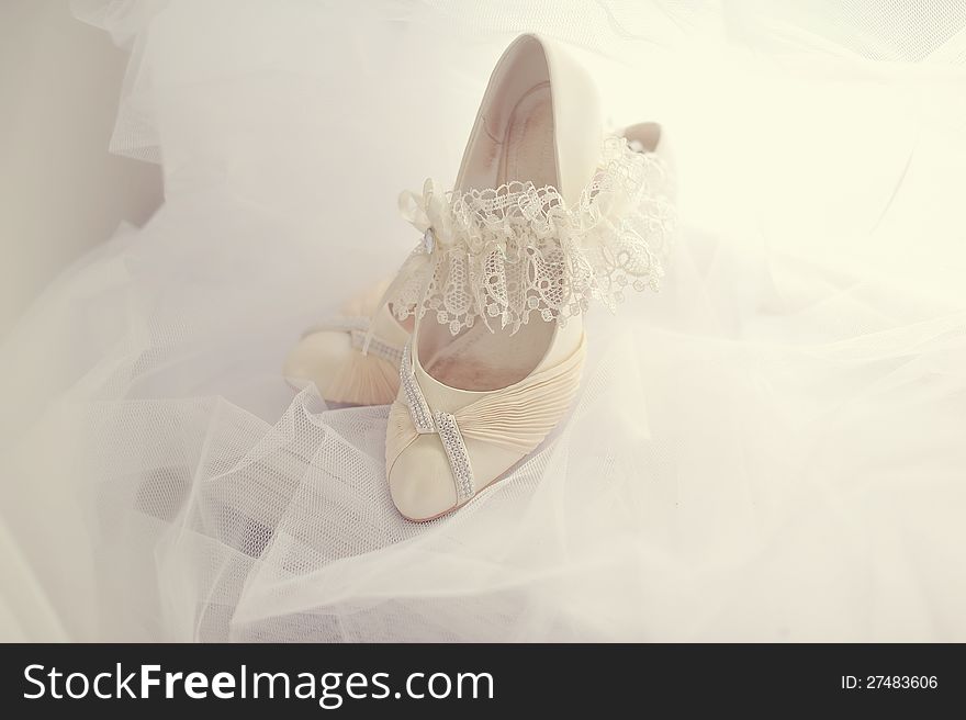 White shoes of the bride on a white background. White shoes of the bride on a white background