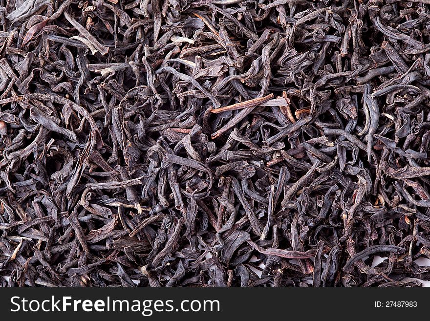 Dried leaves of black tea, a delicious strong drink.