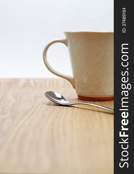 Coffee or tea mug with wood plate on white background. Coffee or tea mug with wood plate on white background