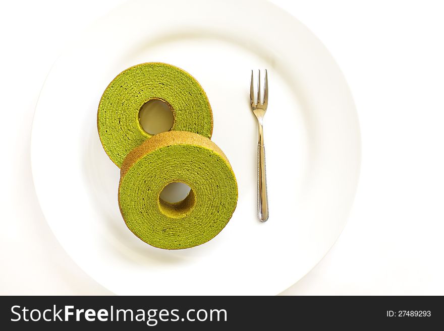 Sponge cake  green tea isolated on white background. Sponge cake  green tea isolated on white background