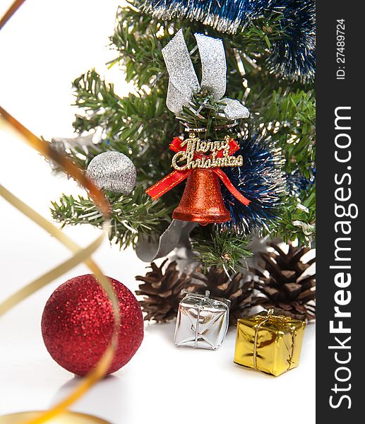 Gifts,cones,Christmas ball,serpentine,dressed up fur-tree on the white