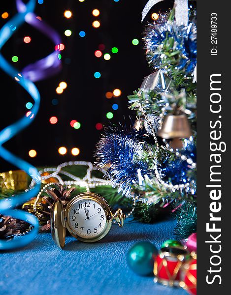 watch, toys,a decorated  tree,on a black