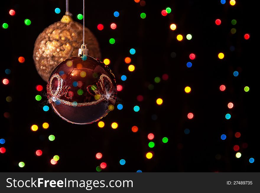 Two Christmas Globe Hanging In The Black