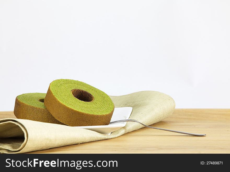 Sponge cake  green tea isolated on white background. Sponge cake  green tea isolated on white background