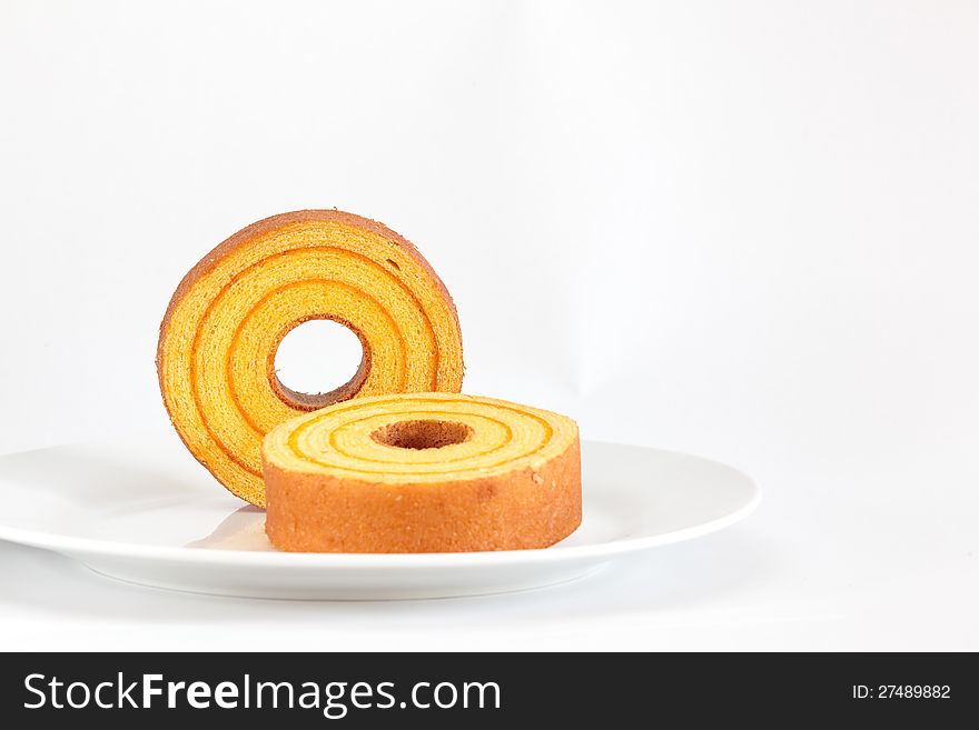 Sponge cake  orange  isolated on white background. Sponge cake  orange  isolated on white background